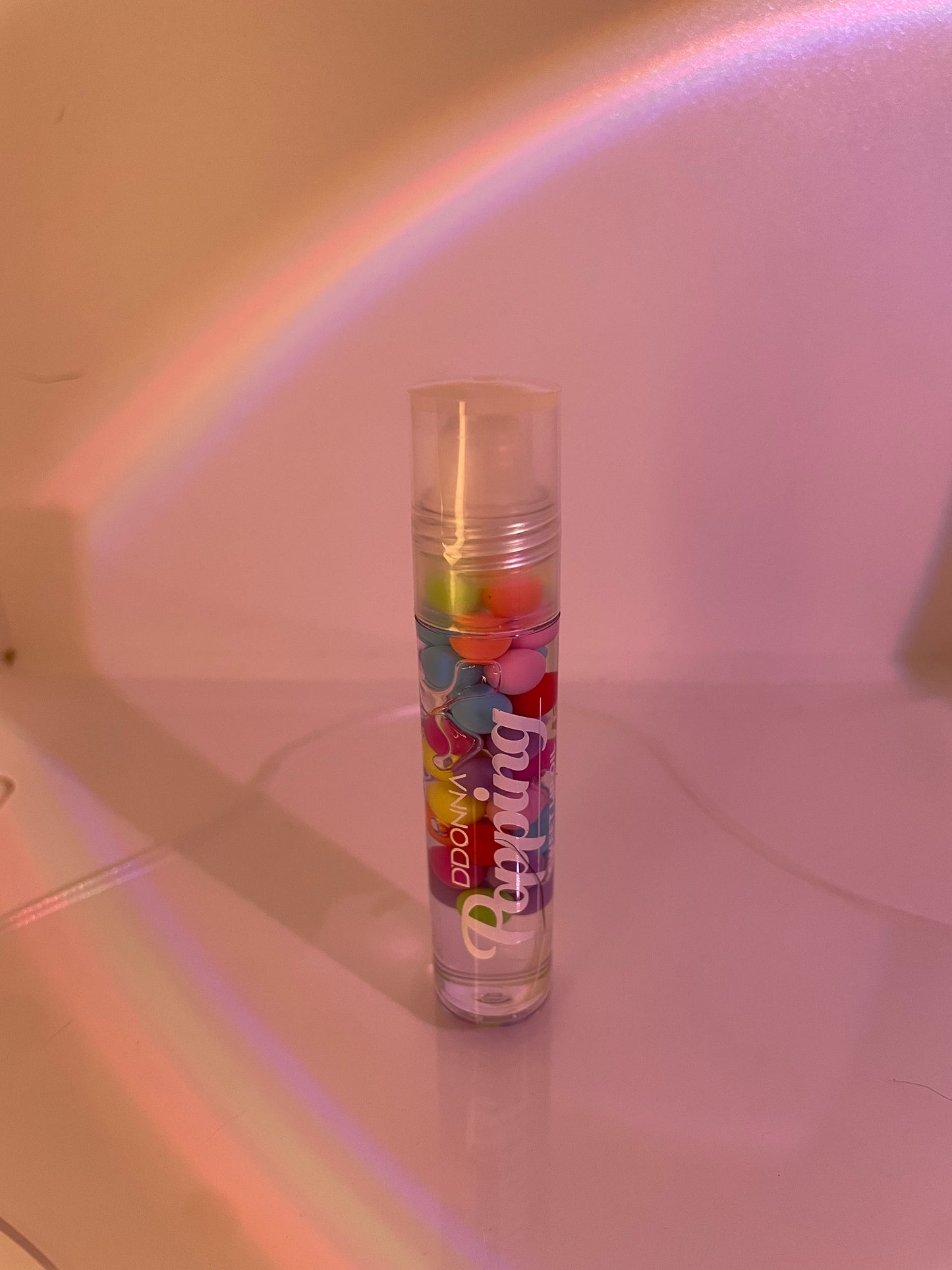 lip oil with colourful little balls