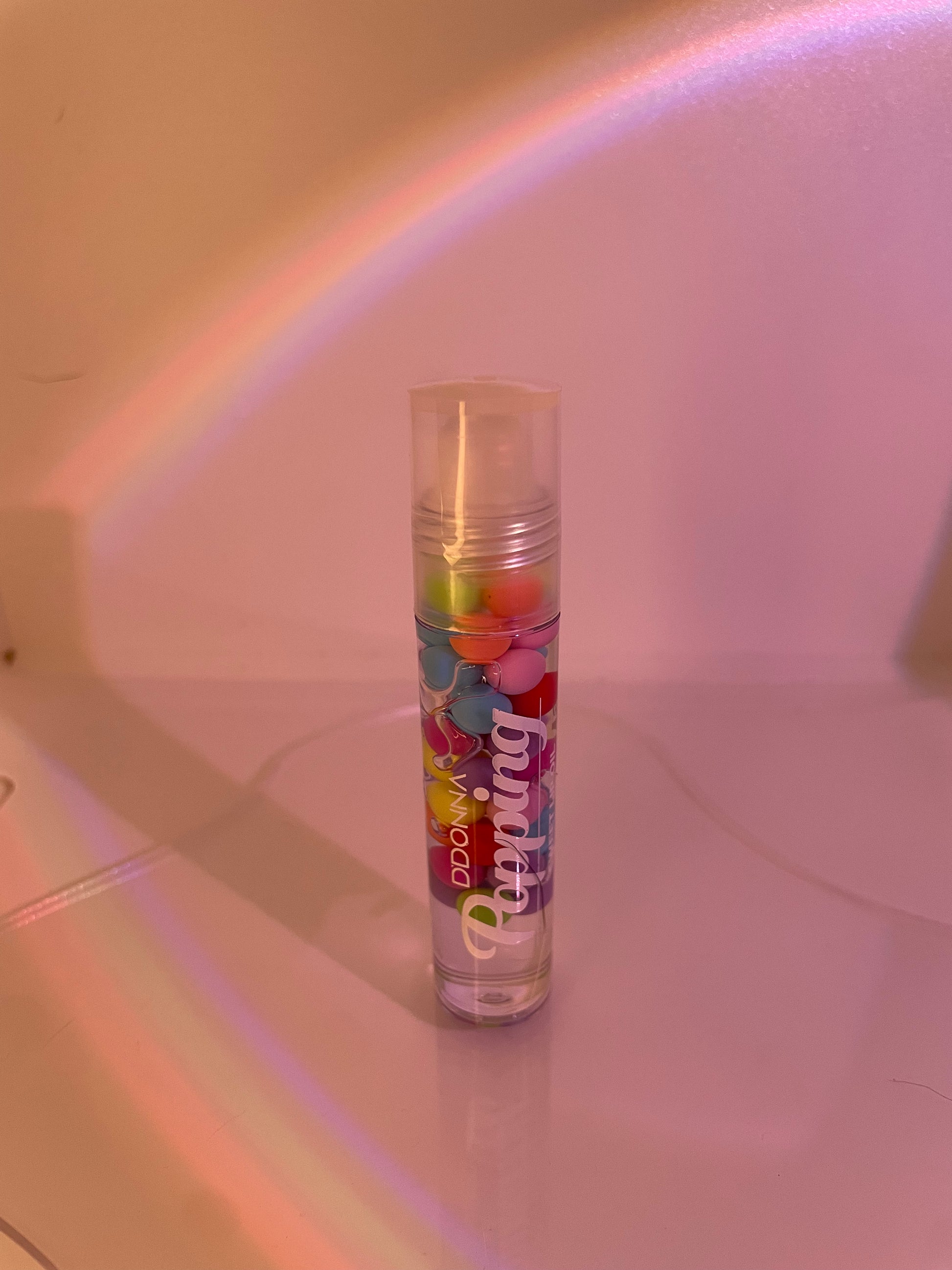 lip oil with colourful little balls