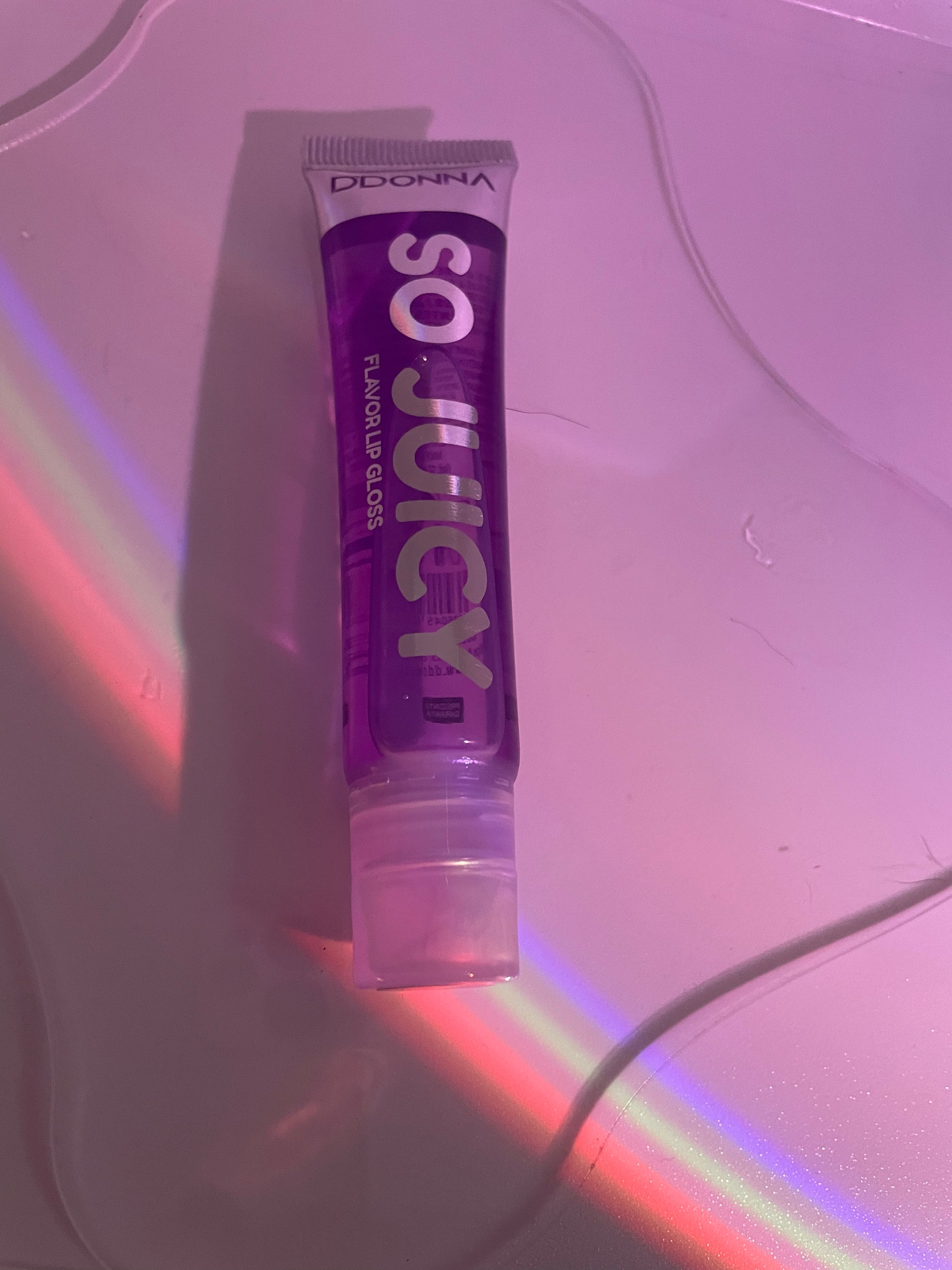 Purple fruity lip gloss